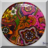 K26. Vintage lucite trivet with bright floral base 7.5 - $10 